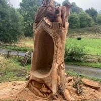 a sand castle made from a tree stump