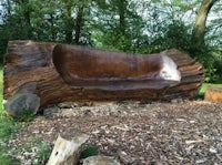 a bench made out of a tree stump