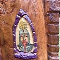 a wooden door with an image of a knight on it