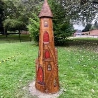 a wooden tower in a park