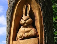 a carving of a rabbit in a tree