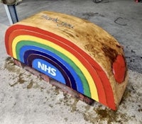 a rainbow shaped log with the words thank nhs on it