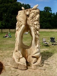 a large sculpture of a tree in a park